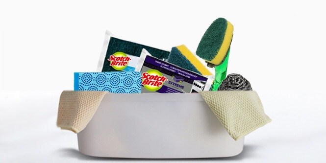 Scotch-brite™ kitchen cleaning tools in a bucket
